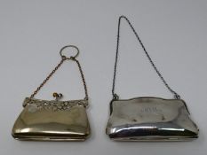 A silver and silver plated finger held ladies coin purse. The silver plated purse has a repousse