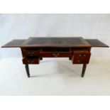 An early 19th century mahogany writing table with tooled leather inset top and two pull out slides