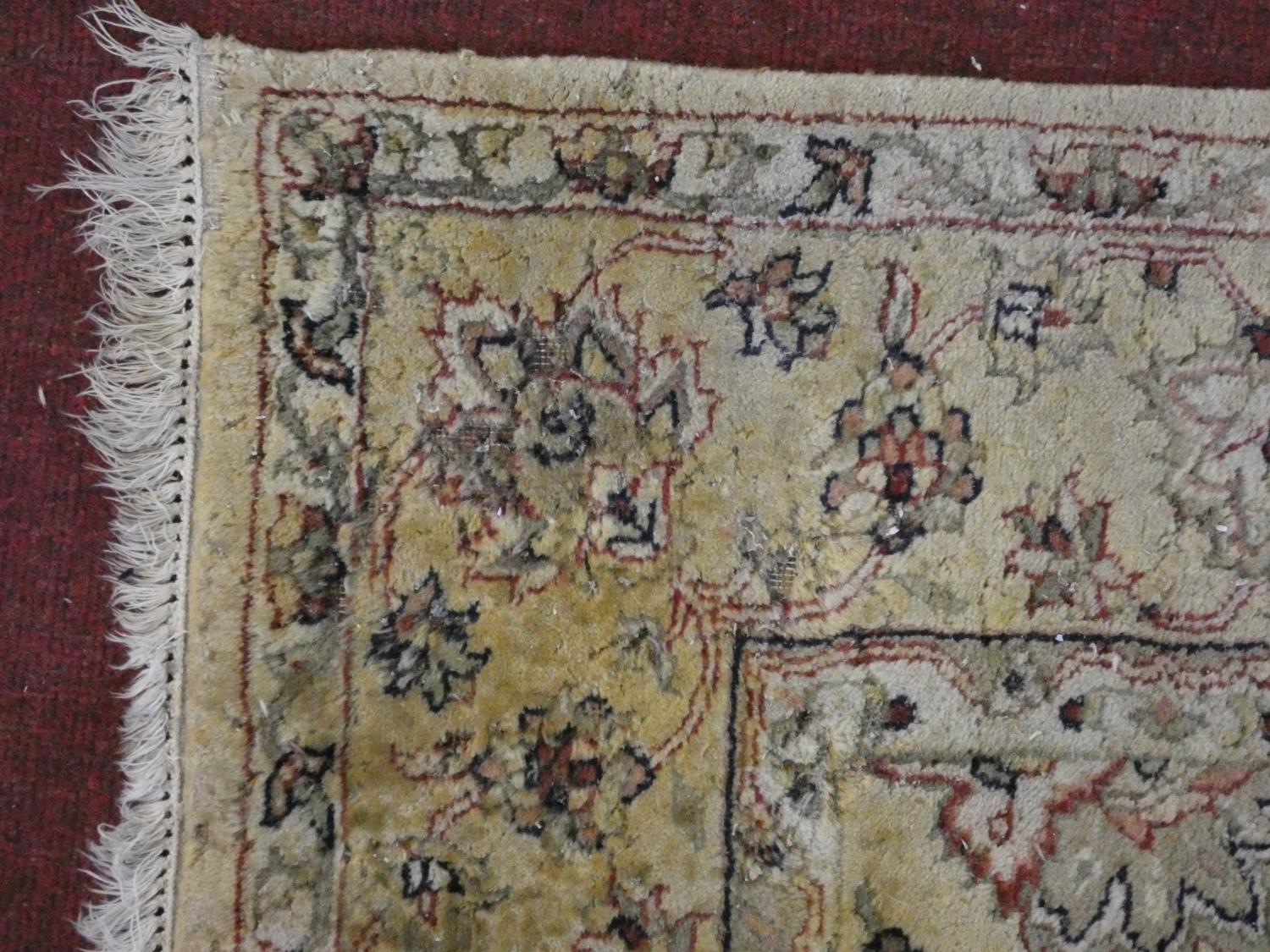 A Persian style rug with all over naturalistic scrolling floral decoration on a cream ground - Image 2 of 4