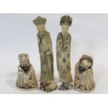 Four various Chinese moulded figures of immortals along with two similar netsukes. Stamp to base.