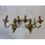 A pair of heavy solid brass Dutch style two branch wall candelabras. H.31cm