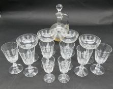 A collection of antique hand cut crystal cross hatched design glasses and decanter. Including four