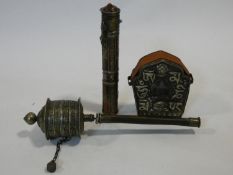 Three Tibetan Bhuddist religious items. Including a brass and copper prayer wheel, a scroll holder