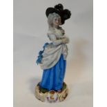 An antique Levy & Co porcelain hand painted figure of a lady in a blue dress with feather hat,