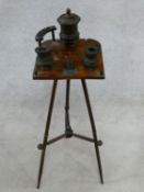 A late 19th century walnut smoker's stand with treen fittings and hand painted floral decoration.