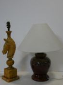 A vintage carved alabaster table lamp in the form of a horses head on stepped base along with a