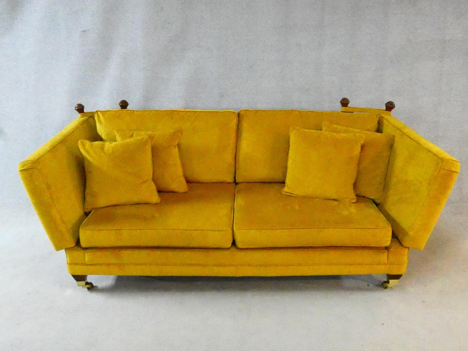 A contemporary Knole sofa in gold upholstery raised on squat square tapering supports on brass cup - Image 2 of 11
