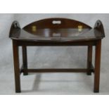 A 19th century style mahogany folding butler's tray on stand. H.48 L.93 W.68cm