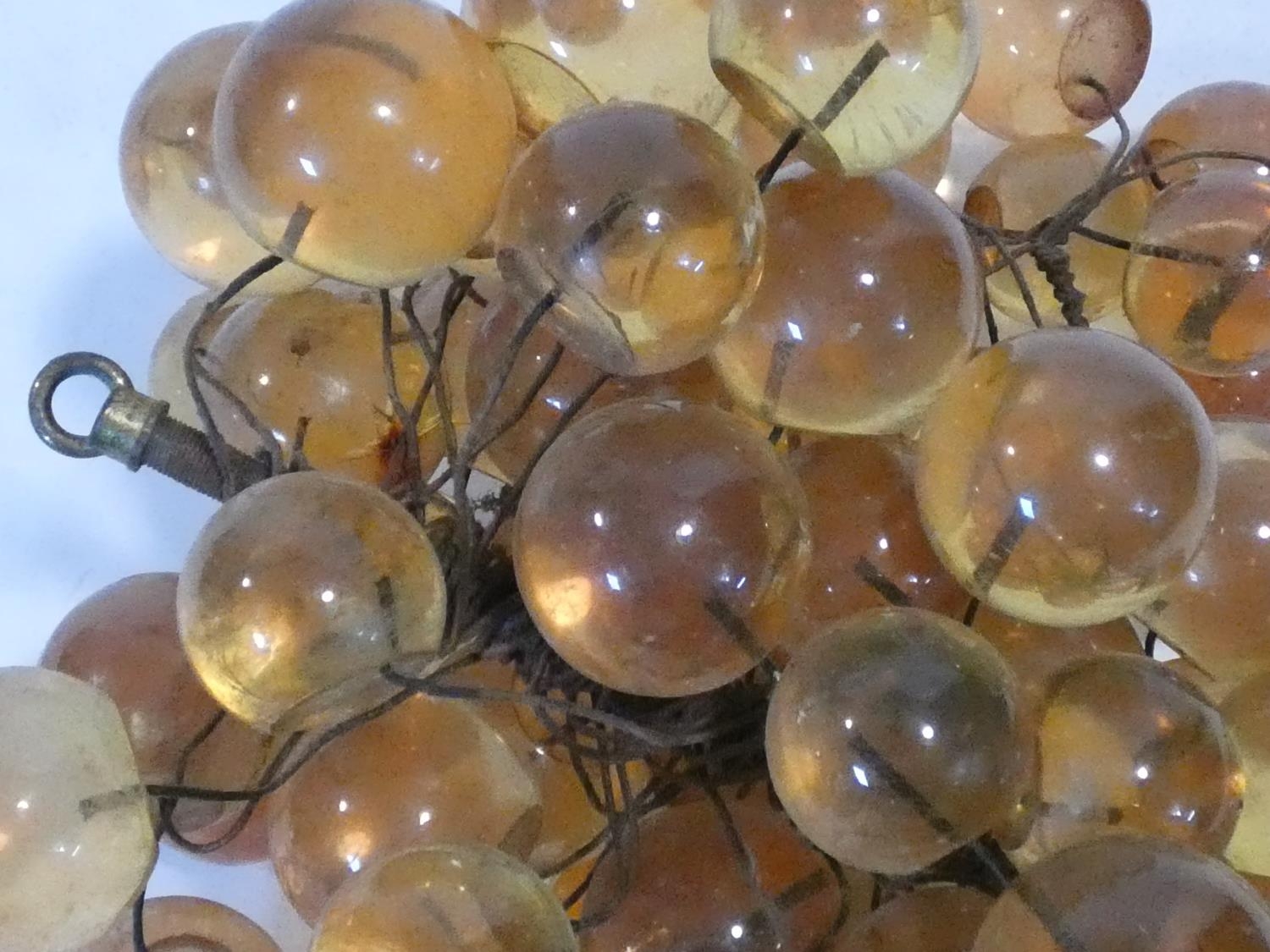 A vintage amber acrylic bunch of grapes mounted on wires. H.19xW.34xL.28cm - Image 4 of 4