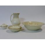An early 19th century Wedgwood bathroom set in an ivory blush palette ceramic to include water