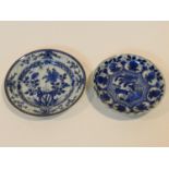 Two 18th century Chinese blue and white export ware plates. One with a stylised floral design and