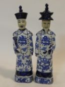 A pair of Chinese ceramic blue and white male standing figures, character marks to the base. H.38cm