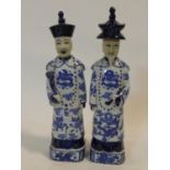 A pair of Chinese ceramic blue and white male standing figures, character marks to the base. H.38cm