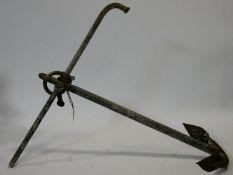 A large antique cast iron ship's anchor. 73x70cm