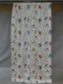 A pair of lined nursery curtains decorated with song birds and owls on branches. 226x120cm