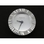 A Tiffany & Co Swiss made stainless steel Roman numeral quartz alarm clock with brushed chrome bezel
