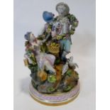 A Meissen hand painted porcelain figure group, 19th century, two lovers, doves and a girl playing