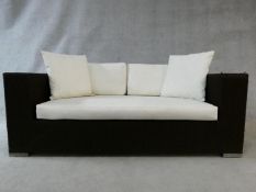A woven style brown terrace sofa in waterproof materials for outside use. H.72xW.174xD.87cm