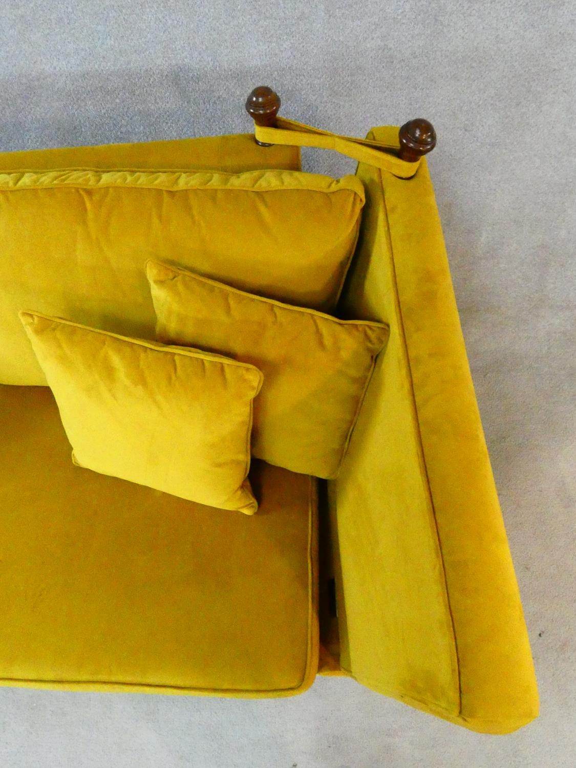 A contemporary Knole sofa in gold upholstery raised on squat square tapering supports on brass cup - Image 10 of 11