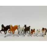 A collection of porcelain animals including four hand painted porcelain Beswick horses, makers stamp