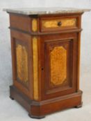 A late 19th century walnut and burr maple pot cupboard with veined marble top above frieze drawer