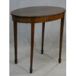 An Edwardian mahogany and satinwood strung occasional table on square tapering supports