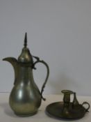 An Eastern brass coffee pot and a 19th century chamberstick and snuffer. H.31cm (tallest)