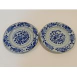 Two 18th century Chinese porcelain export ware plates with stylised floral design within a floral