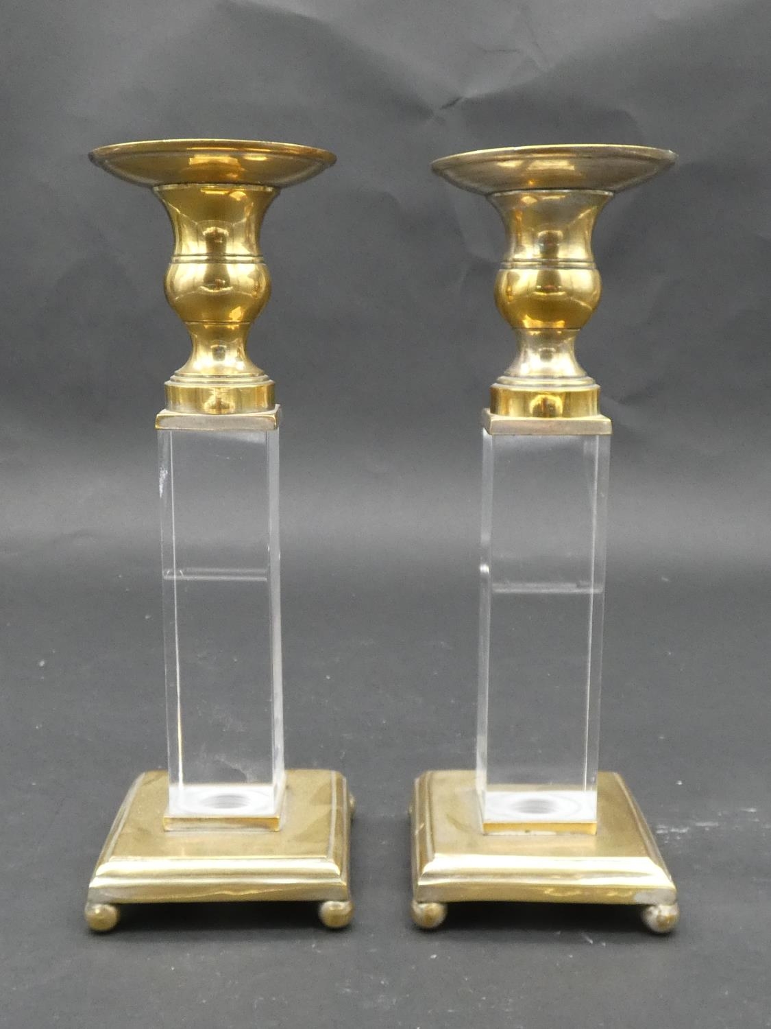 A pair of brass and perspex Empire style candlesticks on platform bases resting on ball feet. H.25cm - Image 2 of 6