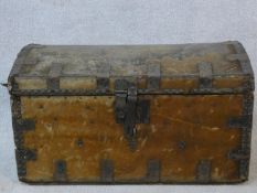 A 19th century iron bound domed top travelling trunk in deer skin hide covering. H.38 W.66 D.39cm