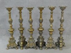 A set of six ecclesiastic style brass pricket candleticks. H.60cm