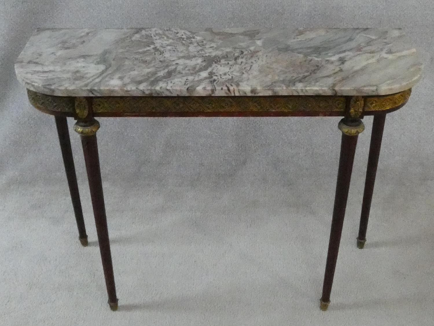 A Louis XVI style mahogany console table with grey veined marble top and ormolu mounts to the frieze
