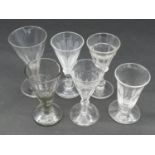 A collection of 19th century glasses. Including five petal cut conical gin glasses and a petal cut