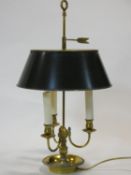 A vintage brass three branch desk lamp with Toleware style shade. H.66cm