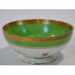 An antique Irish Arklow hand painted porcelain bowl with floral design, apple green band with gilt