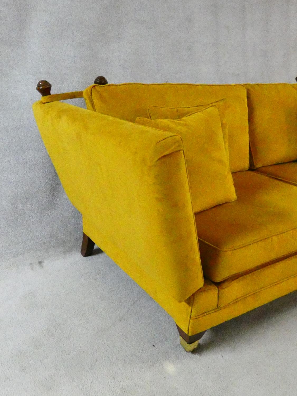 A contemporary Knole sofa in gold upholstery raised on squat square tapering supports on brass cup - Image 6 of 11