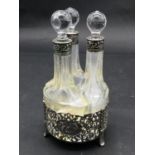 An antique pierced scrolling repousse design Dutch silver cruet set by Zaanlandse