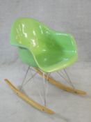 An Eames style RAR rocking chair in pale green. H.80cm