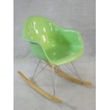 An Eames style RAR rocking chair in pale green. H.80cm