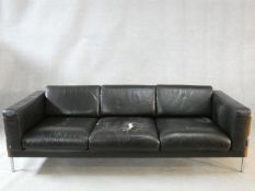 A Robin Day Forum style three seater sofa by Habitat in black leather. H.72 W.206 L.82cm (one