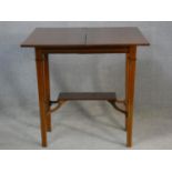 An Edwardian mahogany and satinwood strung fold over top tea table on square tapering supports. H.