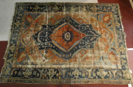 A Shirvan carpet with double central medallion on madder ground contained within floral spandrels
