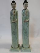 a pair of contemporary celadon crackle glazed Chinese figures, praying Buddhas. H.69cm