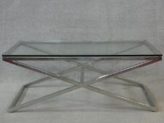 A vintage chromium framed plate topped coffee table on X - shaped base. H.44 L.112 W.52cm