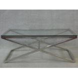 A vintage chromium framed plate topped coffee table on X - shaped base. H.44 L.112 W.52cm