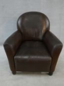 A contemporary vintage style cloud back armchair in tan leather upholstery. H.80xW.78xL.78cm