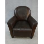 A contemporary vintage style cloud back armchair in tan leather upholstery. H.80xW.78xL.78cm