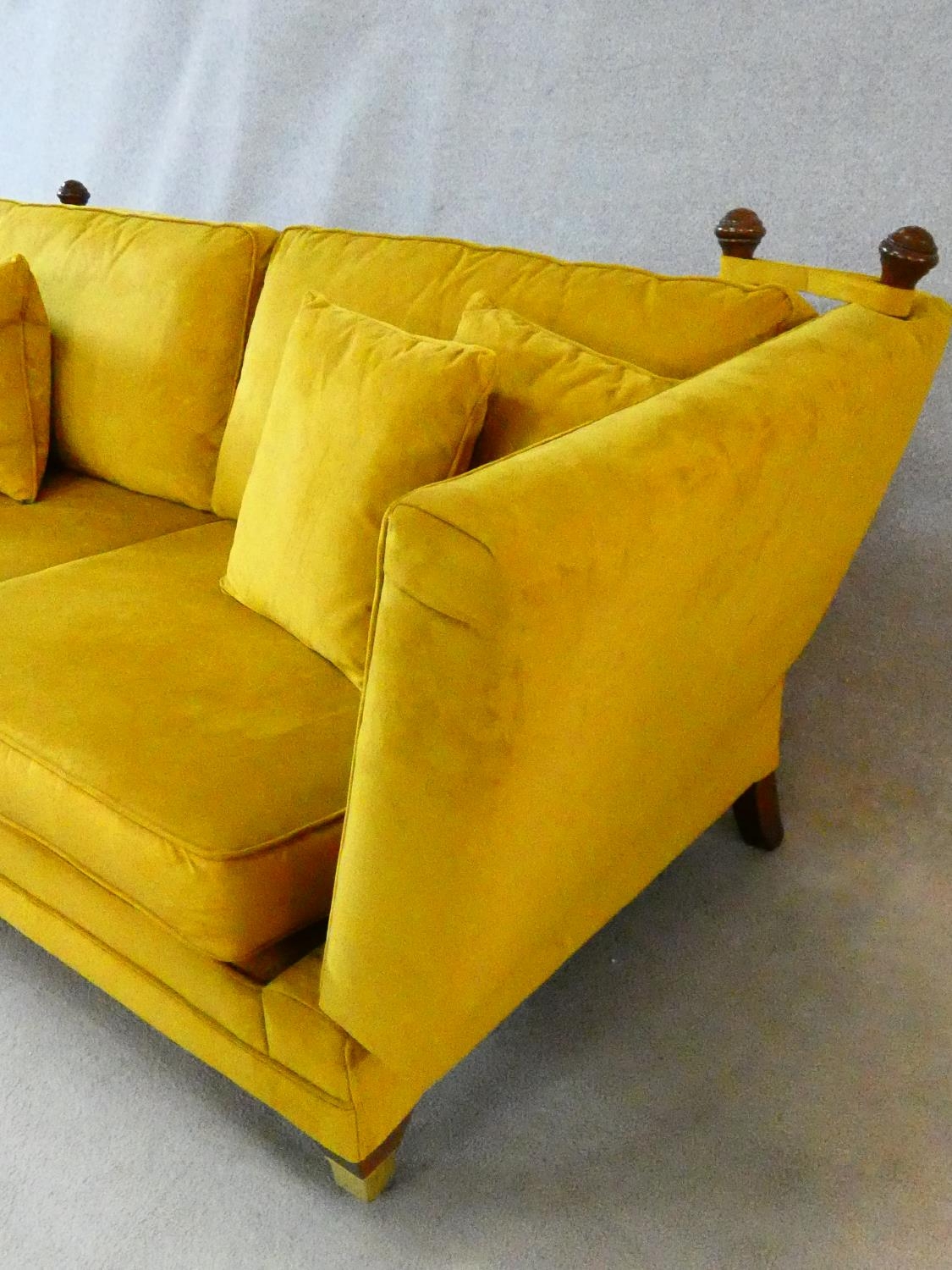 A contemporary Knole sofa in gold upholstery raised on squat square tapering supports on brass cup - Image 7 of 11