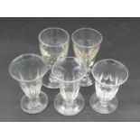 A collection of five 19th and 18th century glasses. Including a petal cut toast master's glass,