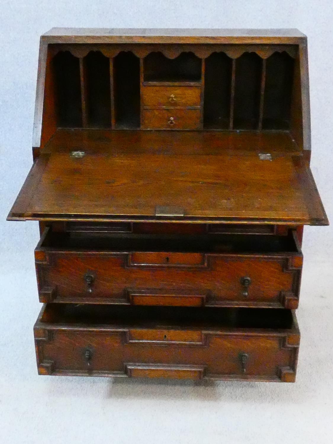 A mid century Jacobean style oak bureau with lozenge inset panels and fall front revealing fitted - Image 4 of 26